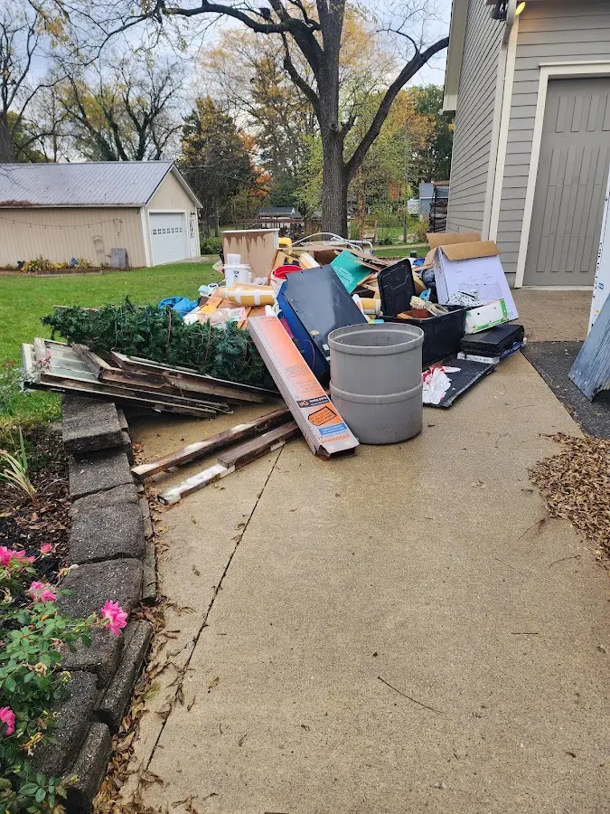 Dumpster being loaded with debris for Demolition Dumpster Rental in Corona